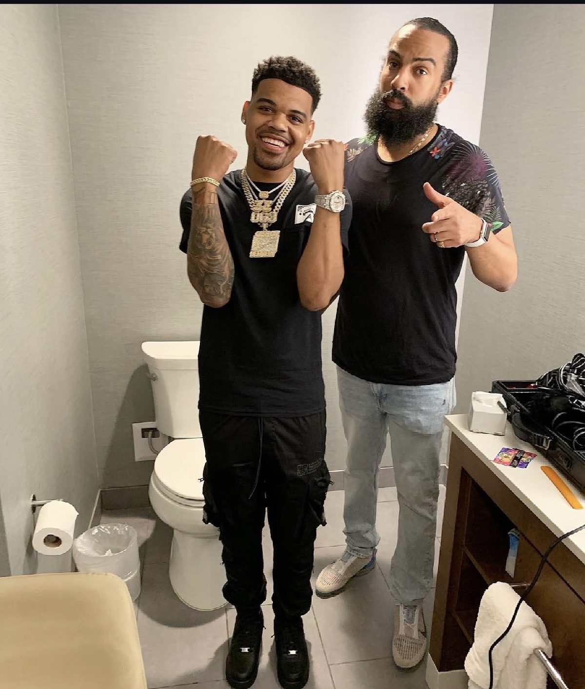 Silas Casher with a client after a cut